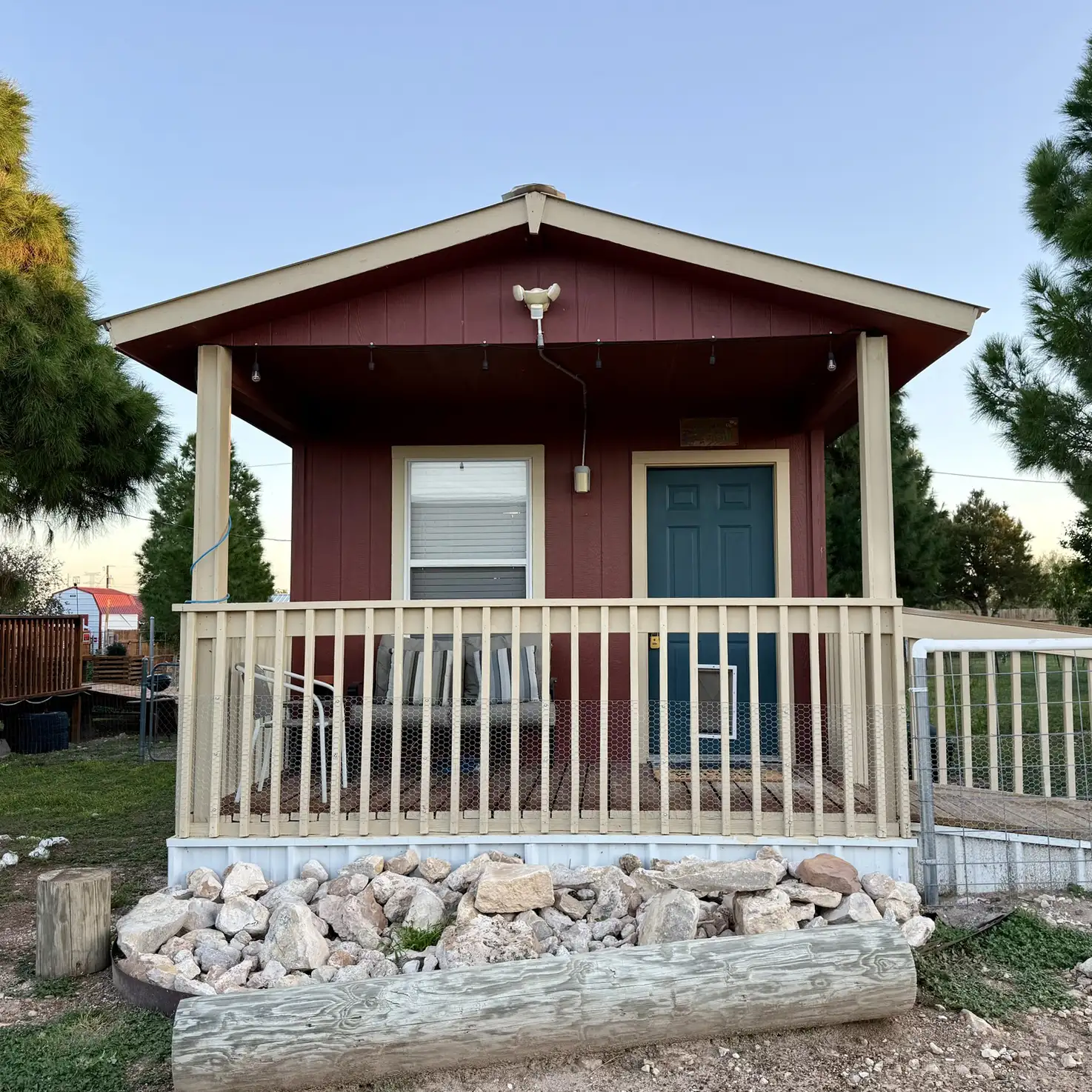 Exterior of the Happy Tails Cabins ramped front porch
